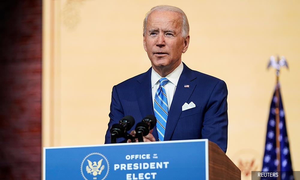 Biden offers gloomy vaccine outlook as US reports first case of Covid-19 variant