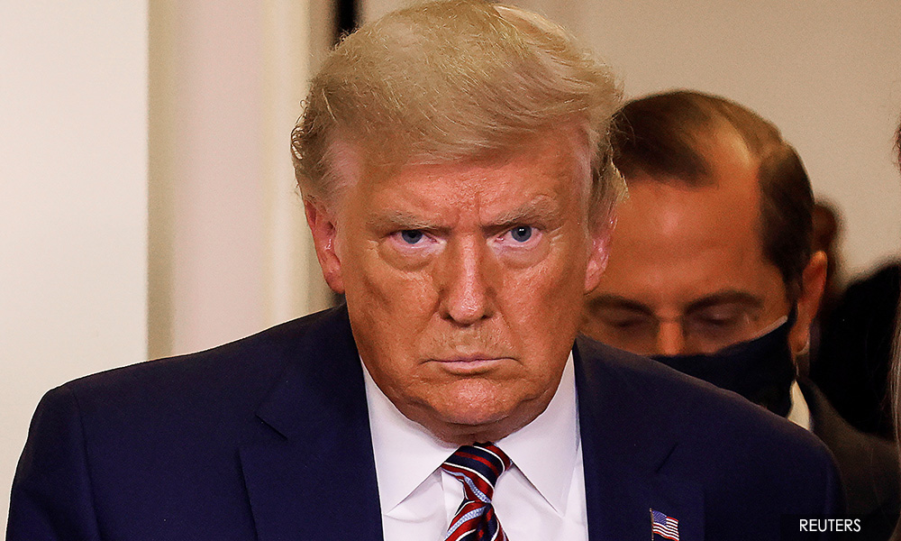 Trump signs bill that could kick Chinese firms off US stock exchanges