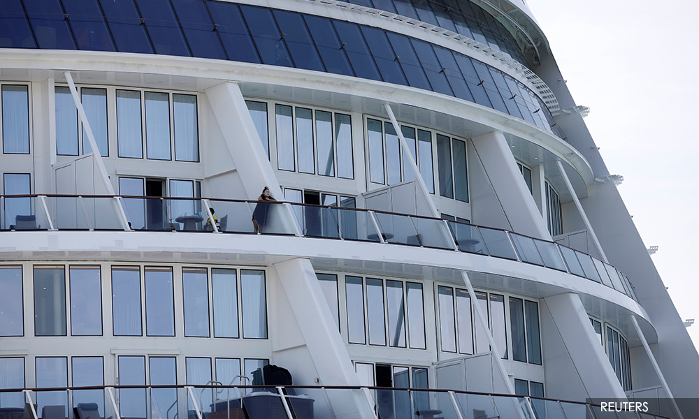 Relieved passengers leave Singapore cruise after Covid-19 scare