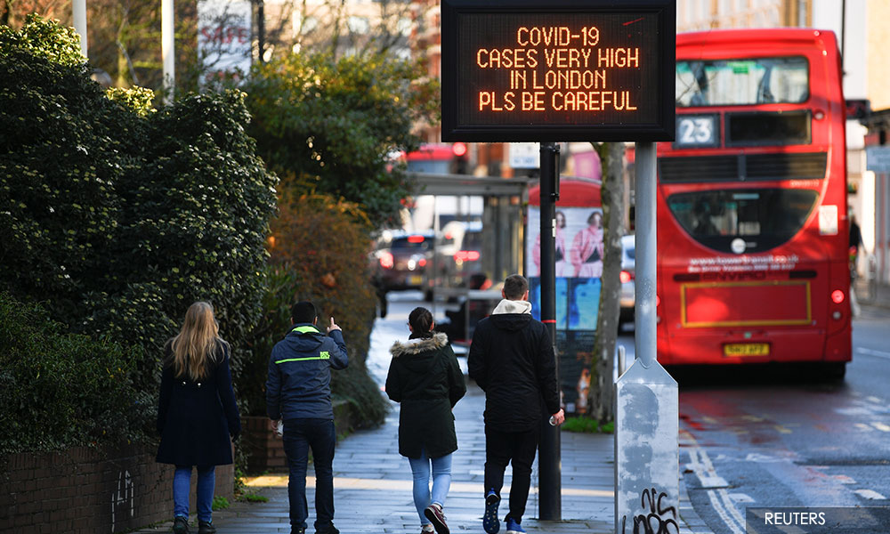 Tougher UK coronavirus curbs may have to last some time