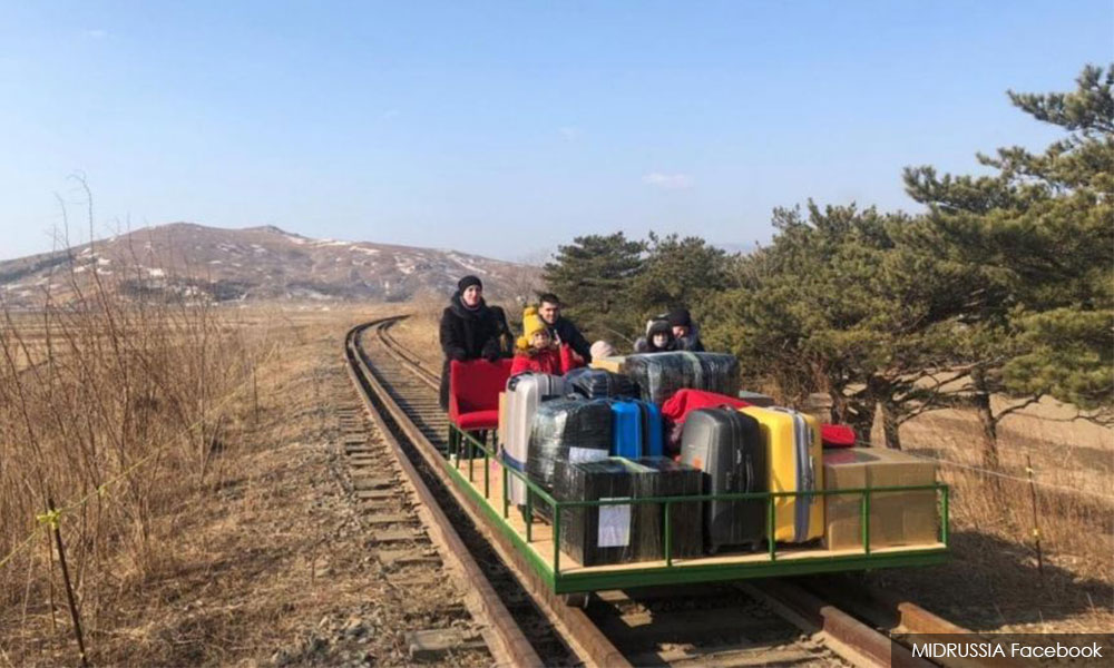 Russian diplomats push their way home with handcar out of North Korea