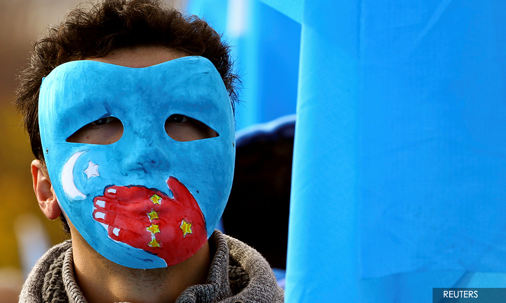 China says door to Xinjiang 'always open', but UN rights boss should not prejudge