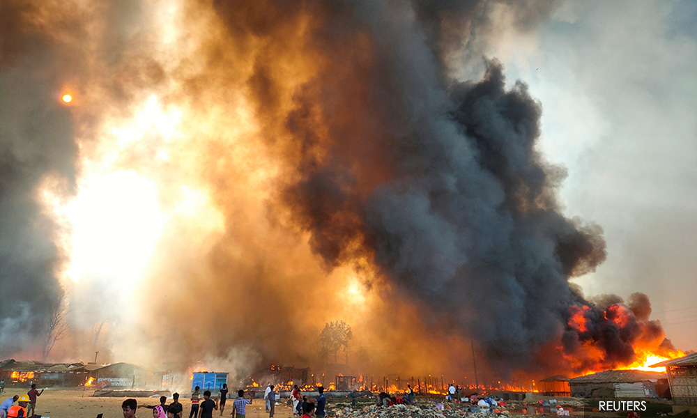 Several dead, thousands of homes burn as fire sweeps Rohingya camp - witnesses