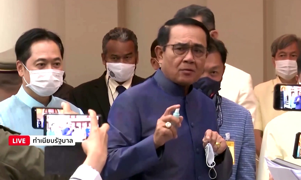 Irked Thai PM sprays reporters with hand sanitiser to duck tricky questions