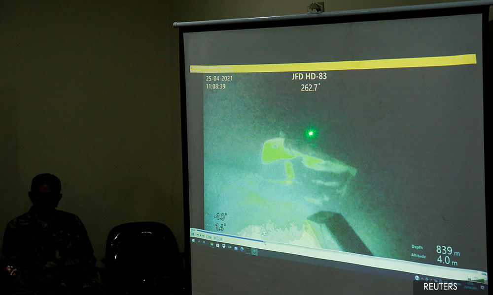 Sunken missing Indonesian submarine found cracked open