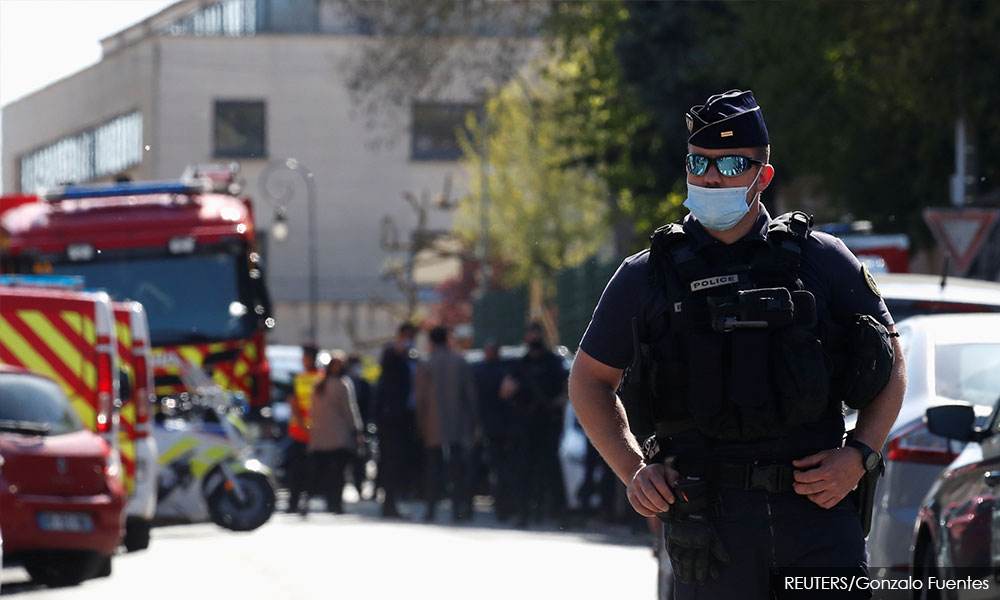 Attacker fatally stabs police employee near Paris, Macron calls it terrorism