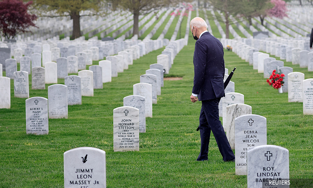 Standing among US graves, Biden explains Afghanistan decision in personal terms