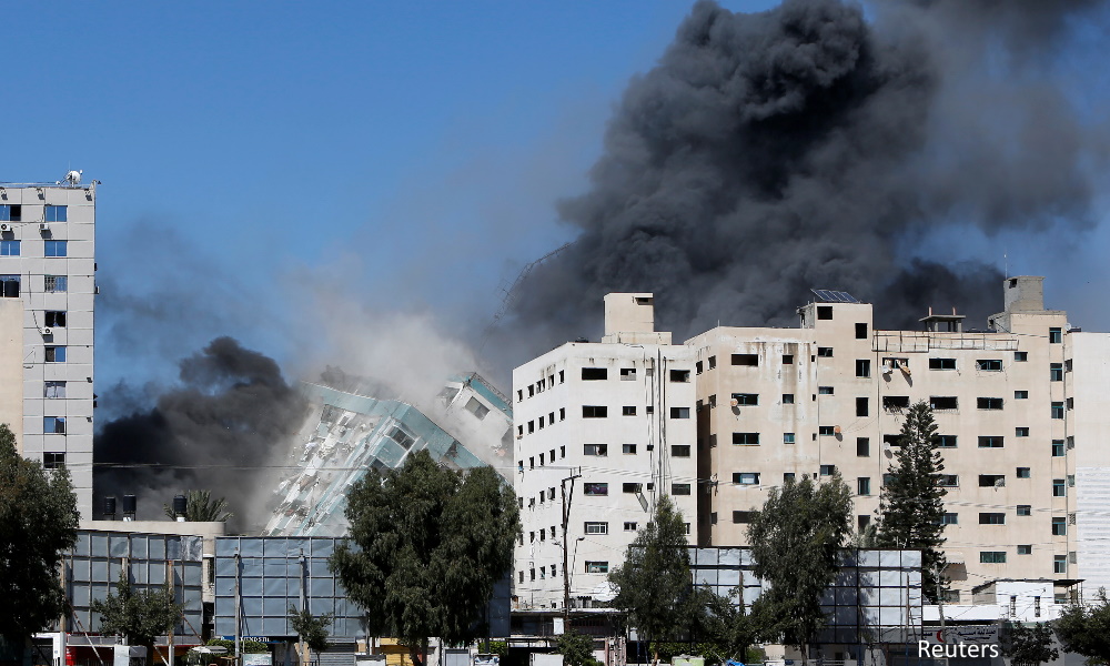 Israel bombs Hamas Gaza chief's home as fighting enters seventh day