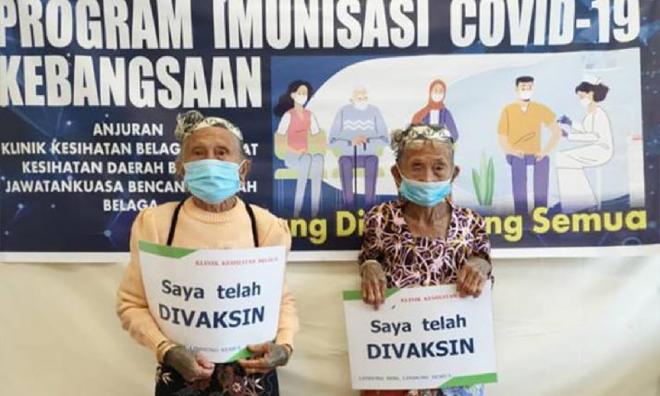 Dua Orang Ulu berusia 80an redah sungai deras untuk dapatkan vaksin