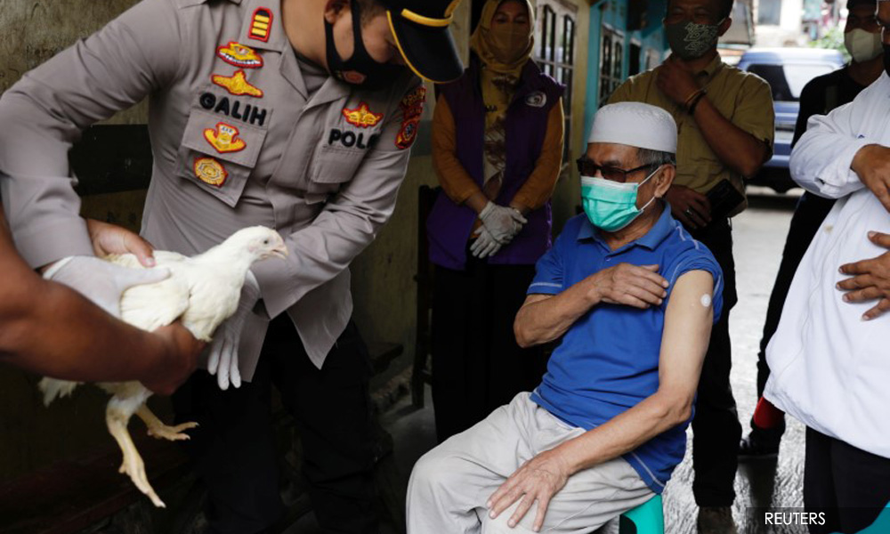 Chickens, cows, apartments offered up in Asia's vaccination lucky draws