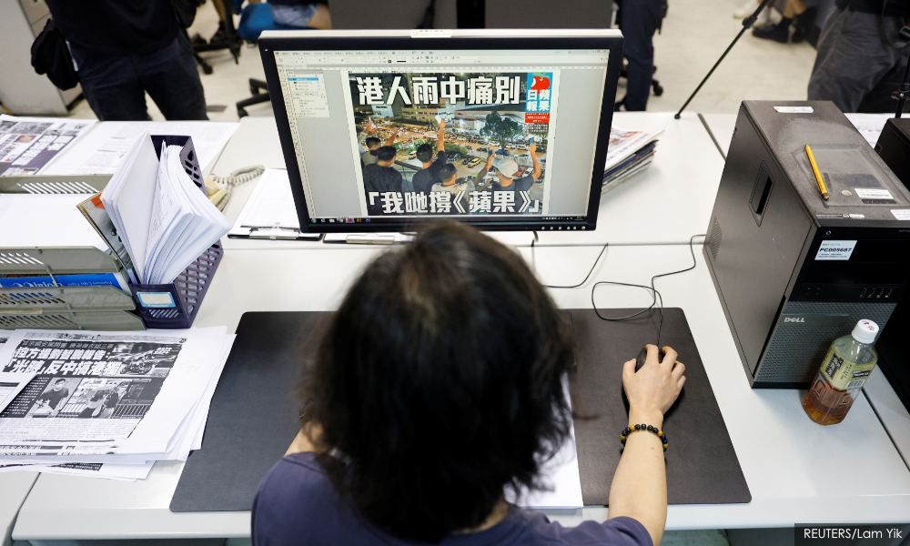Hong Kong police arrest former Apple Daily journalist at airport - media