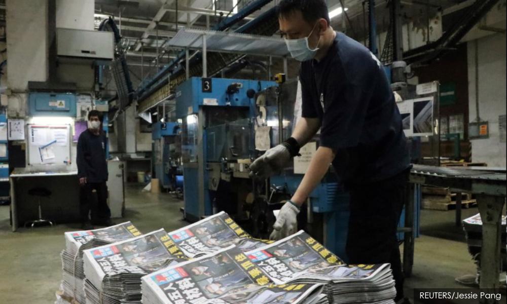 HK democracy supporters snap up Apple Daily copies amid anger at police crackdown