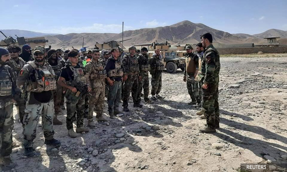 Afghan security personnel flee into Tajikistan as Taliban advance