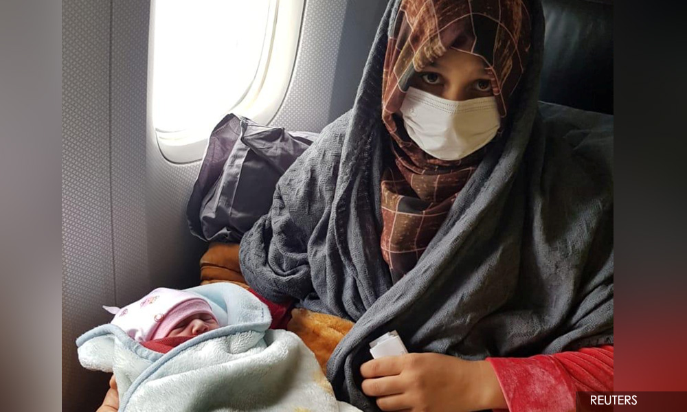 Afghan woman gives birth on evacuation flight to Britain