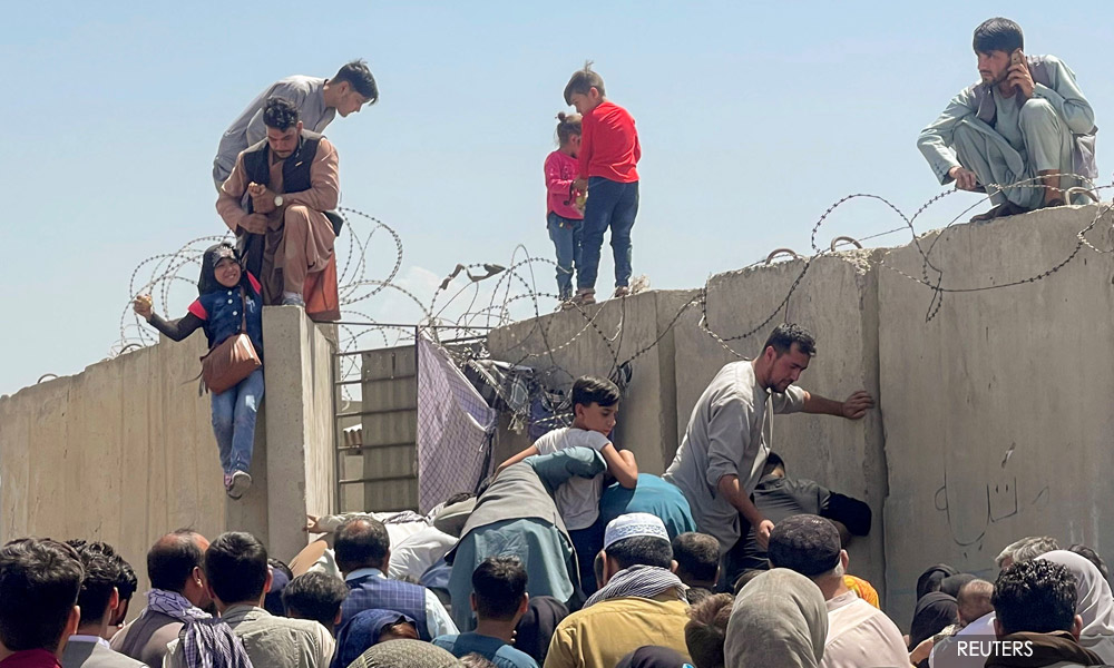 Chaos, death at Kabul airport as Biden defends withdrawal from Afghanistan