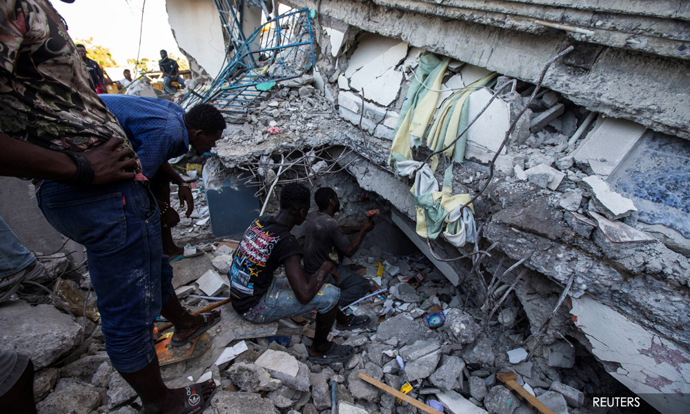 Rescuers race to find Haiti quake survivors as death toll hits 1,297