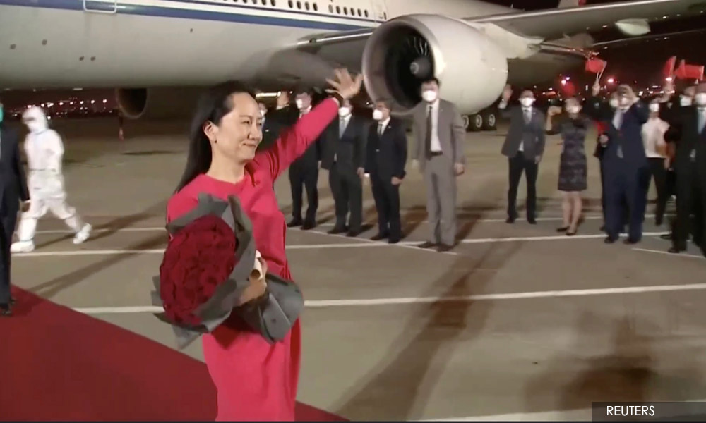China welcomes Huawei executive home, Trudeau hugs Canadians freed by Beijing