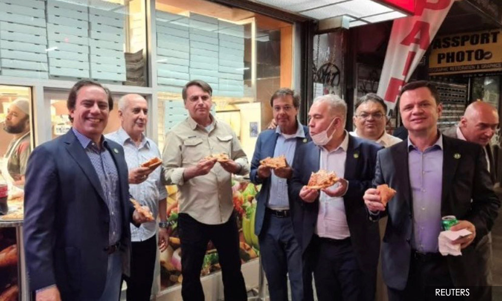 Vaccine sceptic Bolsonaro gets a pass at UN but not New York restaurants