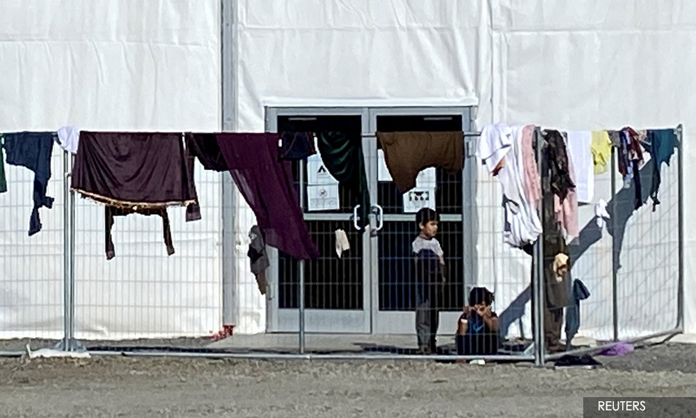 With births and a beauty salon, Afghan 'guests' transform US base
