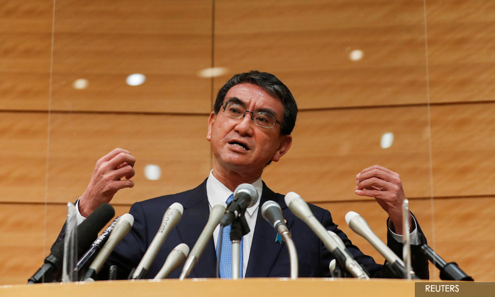 Japan's vaccine minister Kono leads opinion poll on succeeding Suga