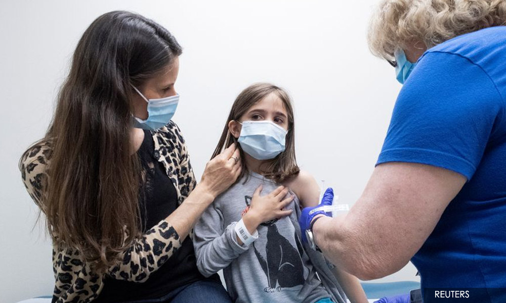 US CDC director breaks with panel, backs Covid-19 boosters for high-risk workers