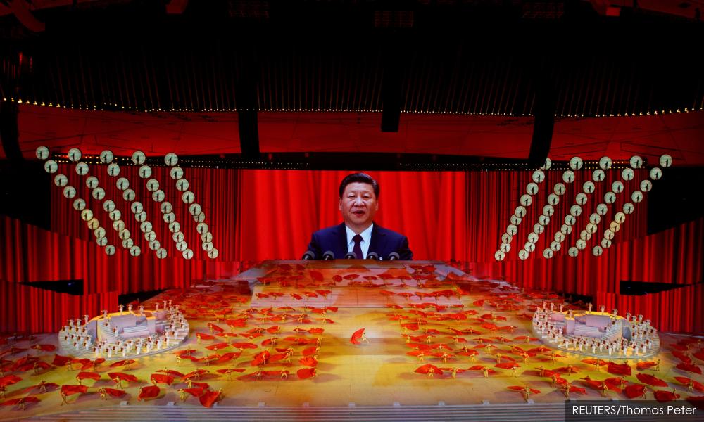 Unleashing reforms, Xi returns to China's socialist roots