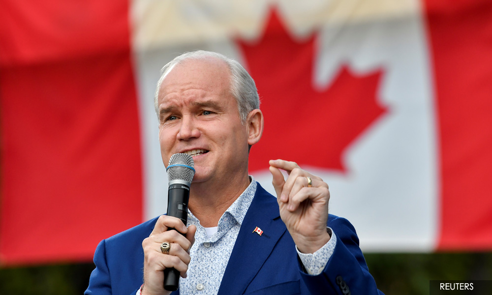 Canada opposition chief, leading in election race, under fire over gun control