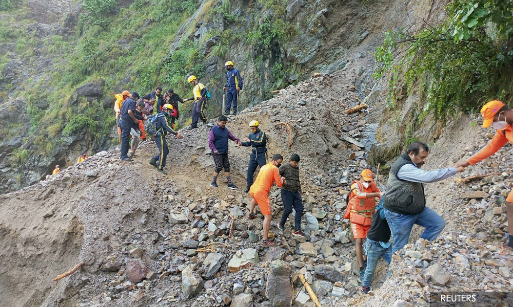 India floods block roads, sweep away bridges and leave 46 dead