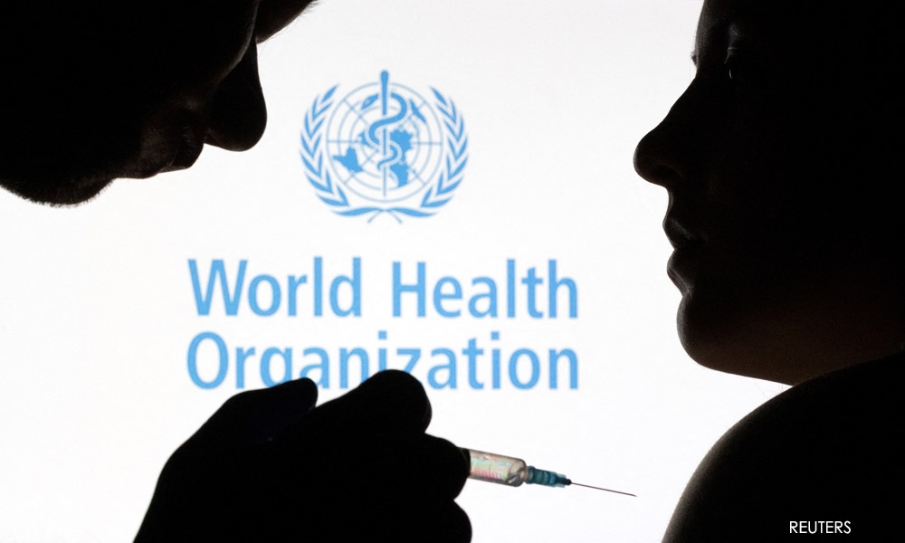 Covid-19 vaccines may be less effective against Omicron - WHO