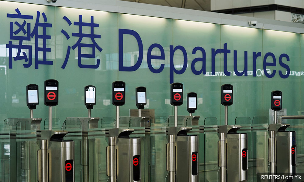 Hong Kong bans some inbound flights, tightens Covid-19 curbs